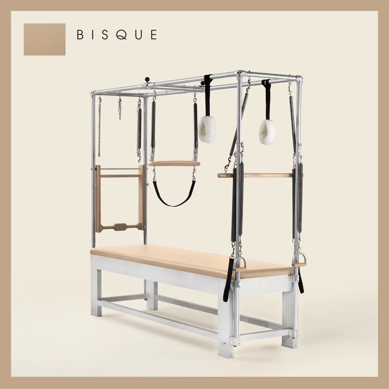 Bisque color Trapeze Table with aluminum frame, adjustable bars, straps, and springs. Premium Pilates equipment against a beige background.