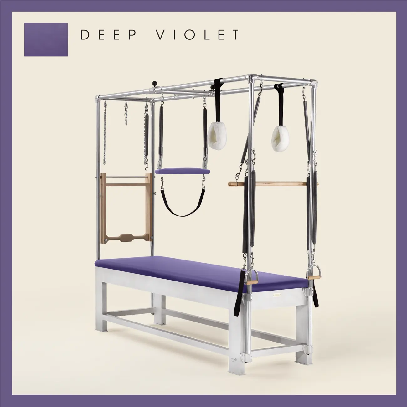 Deep Violet color Trapeze Table with aluminum frame, adjustable bars, straps, and springs. Premium Pilates equipment against a beige background.