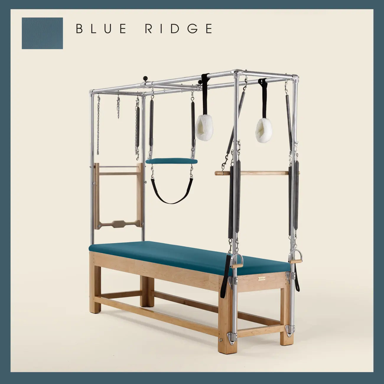 Blue Ridge Pilates Cadillac with maple wood frame, adjustable bars, straps, and springs. Premium Pilates equipment against a beige background.