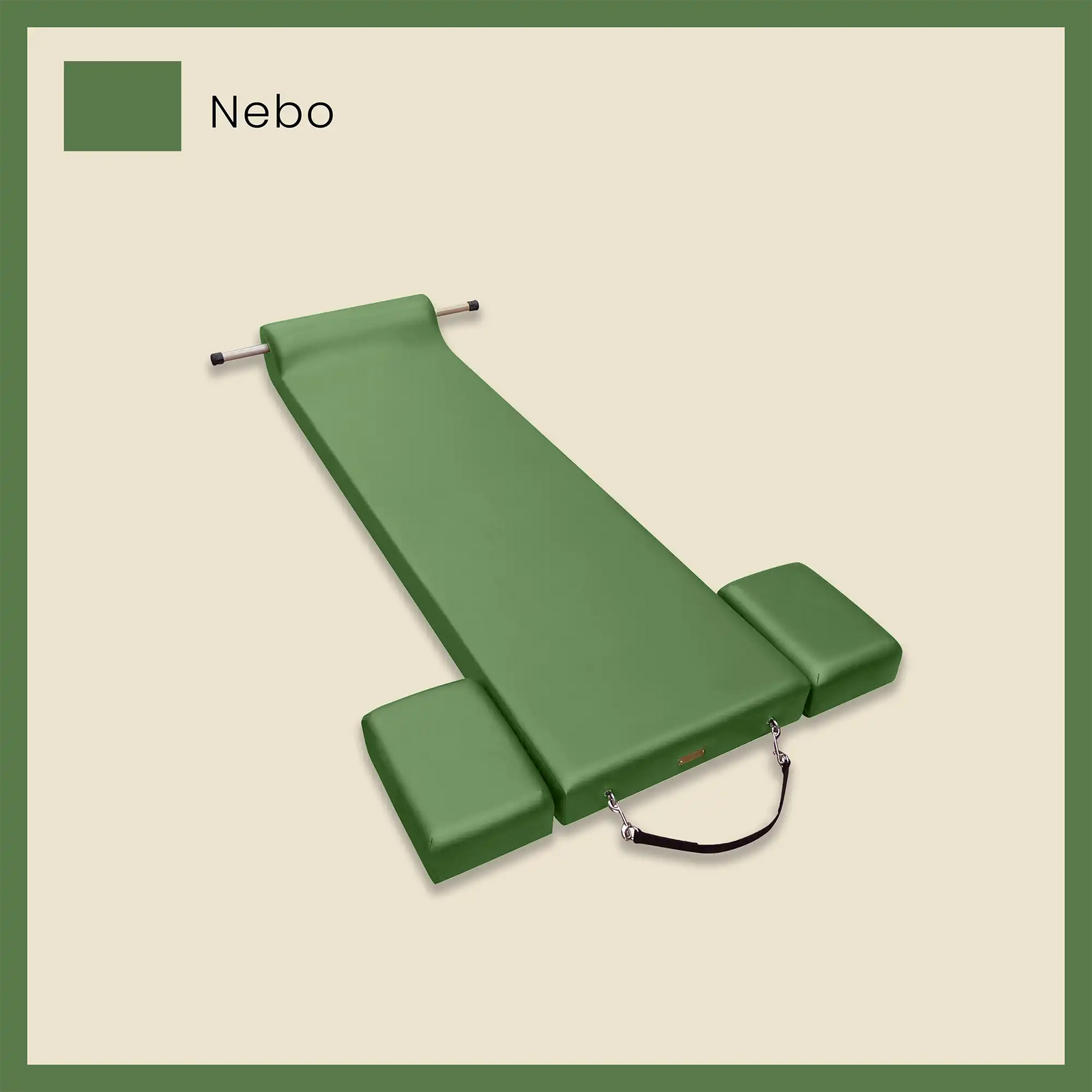 Green pilates mat with side cushions and foot strap on a light beige background.