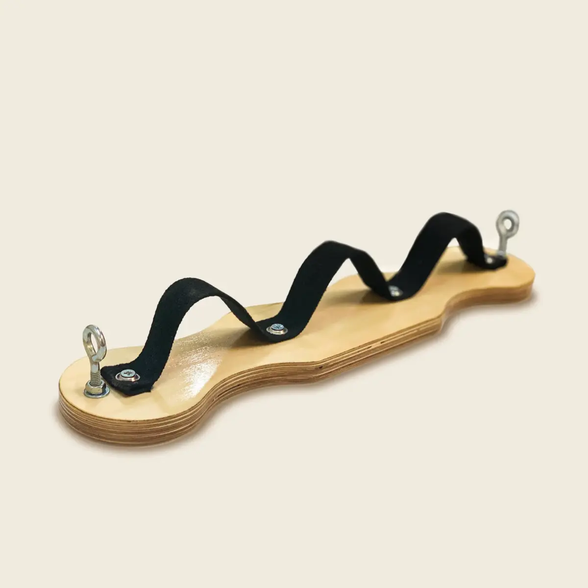 Pilates airplane board featuring a smooth wood finish and three black foot straps for resistance training.