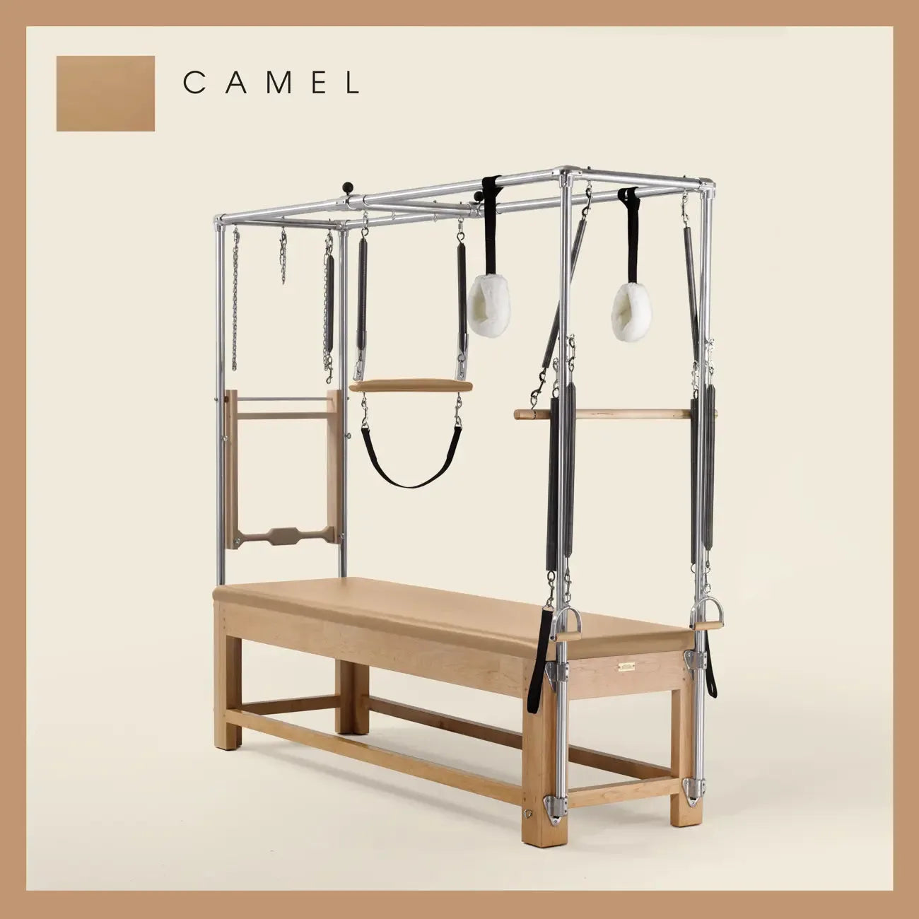 Camel color Pilates Cadillac with maple wood frame, adjustable bars, straps, and springs. Premium Pilates equipment against a beige background.