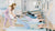 Pilates instructor teaching clients on Gratz Pilates Studio Wall Unit with High Mat