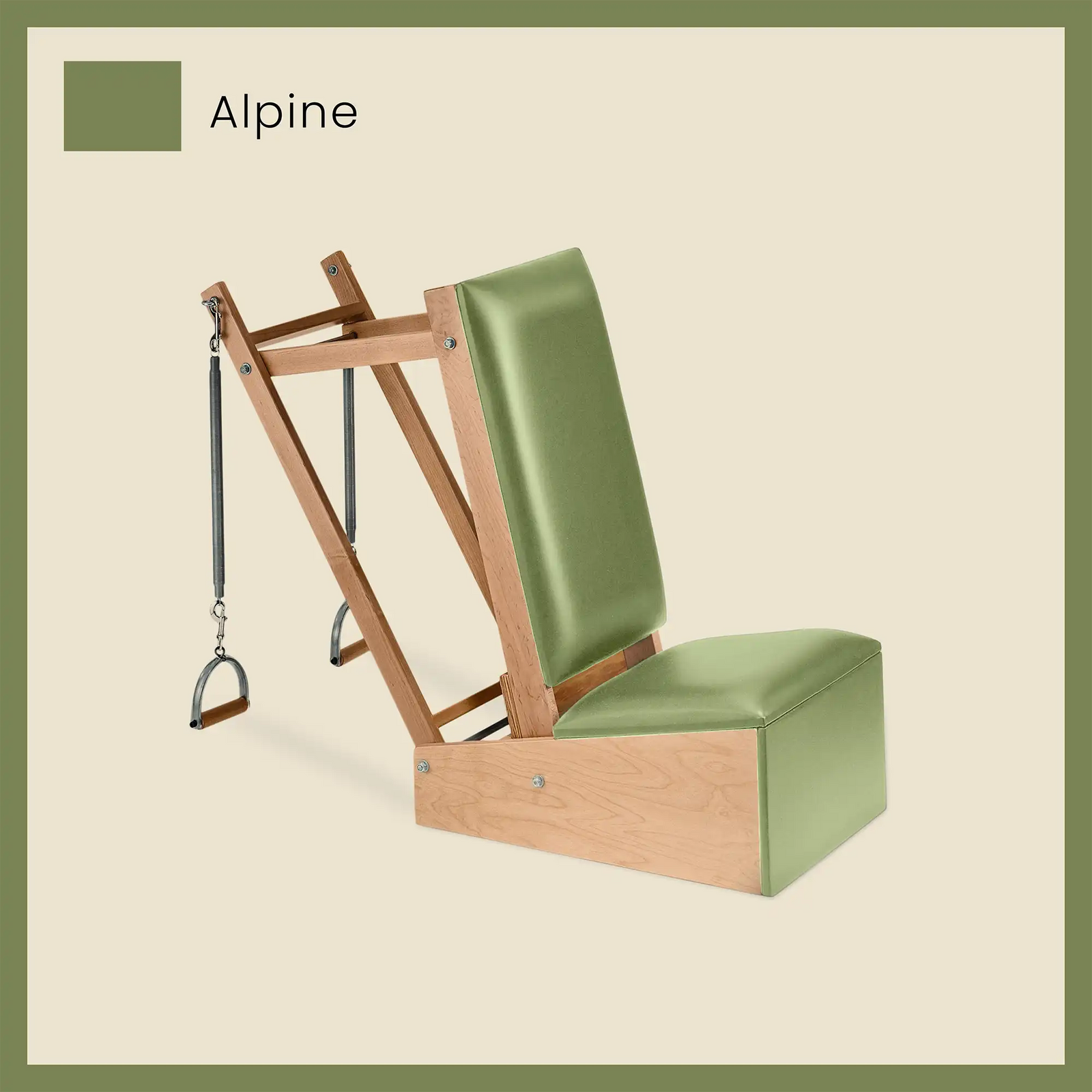 Green Pilates arm chair with Alpine green cushion and spring-loaded handles for Pilates training.