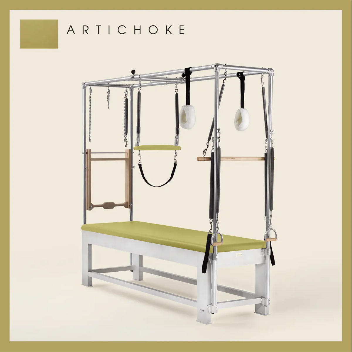 Artichoke color Trapeze Table with aluminum frame, adjustable bars, straps, and springs. Premium Pilates equipment against a beige background.