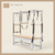 Bisque color Trapeze Table with aluminum frame, adjustable bars, straps, and springs. Premium Pilates equipment against a beige background.