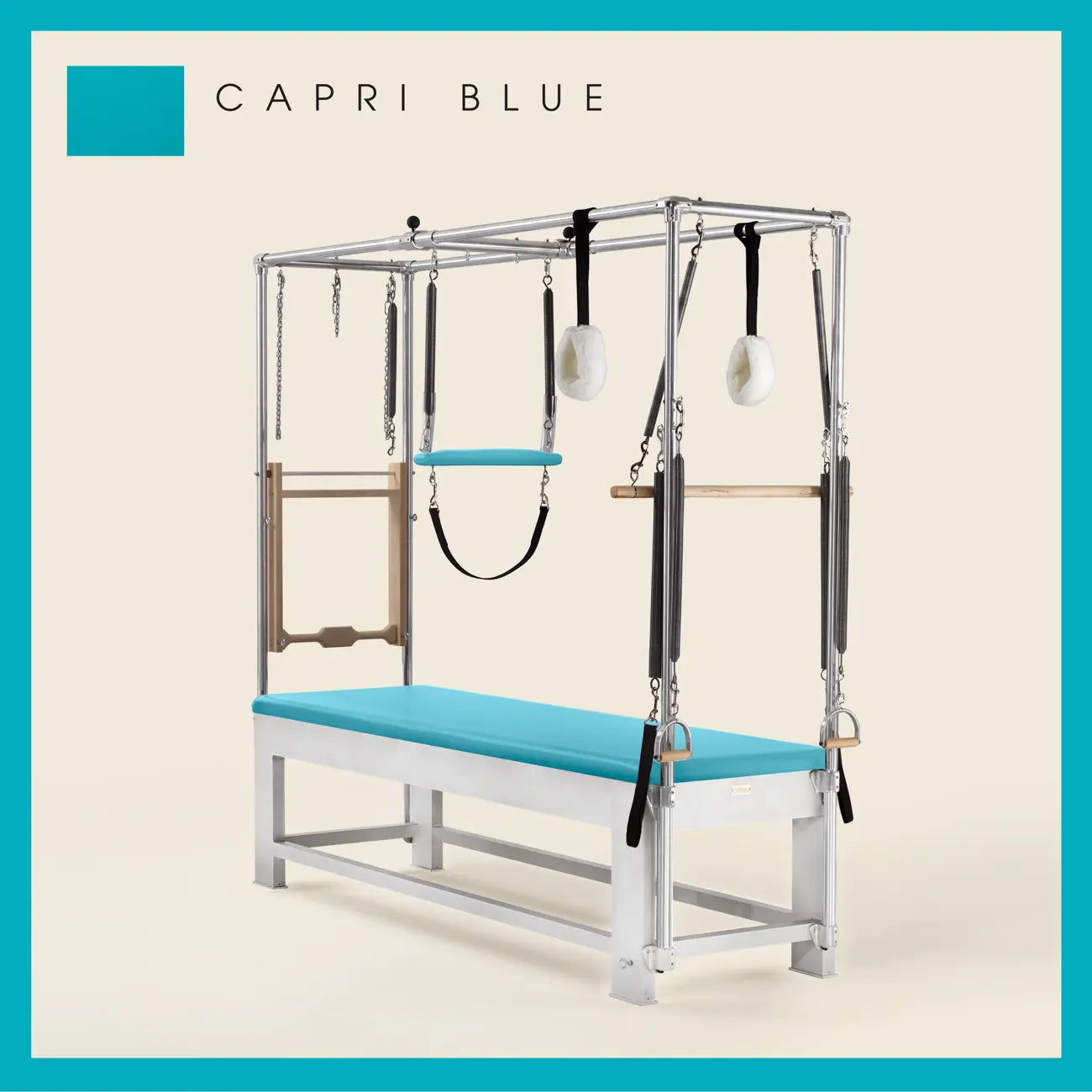Capri Blue color Trapeze Table with aluminum frame, adjustable bars, straps, and springs. Premium Pilates equipment against a beige background.