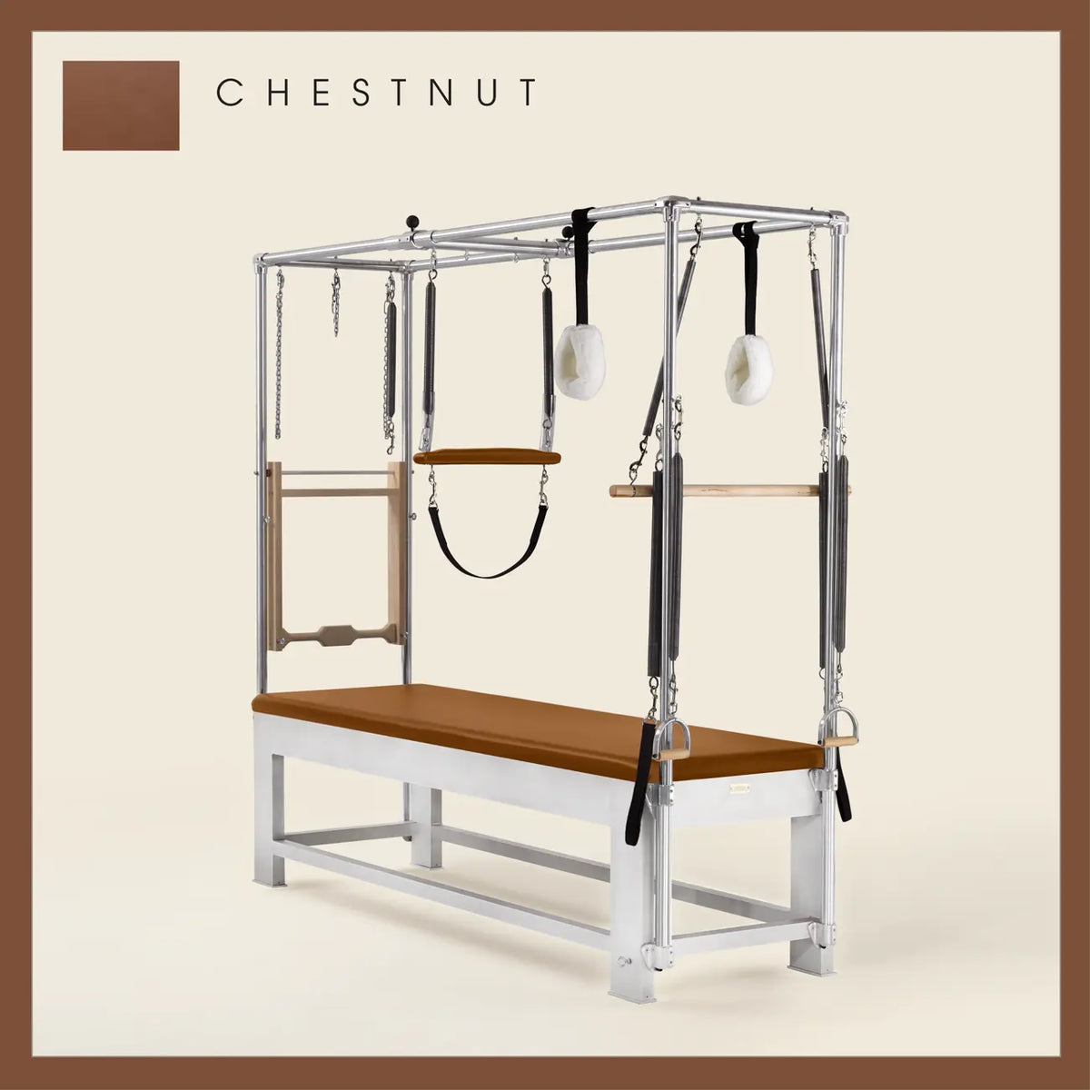 Chestnut color Trapeze Table with aluminum frame, adjustable bars, straps, and springs. Premium Pilates equipment against a beige background.