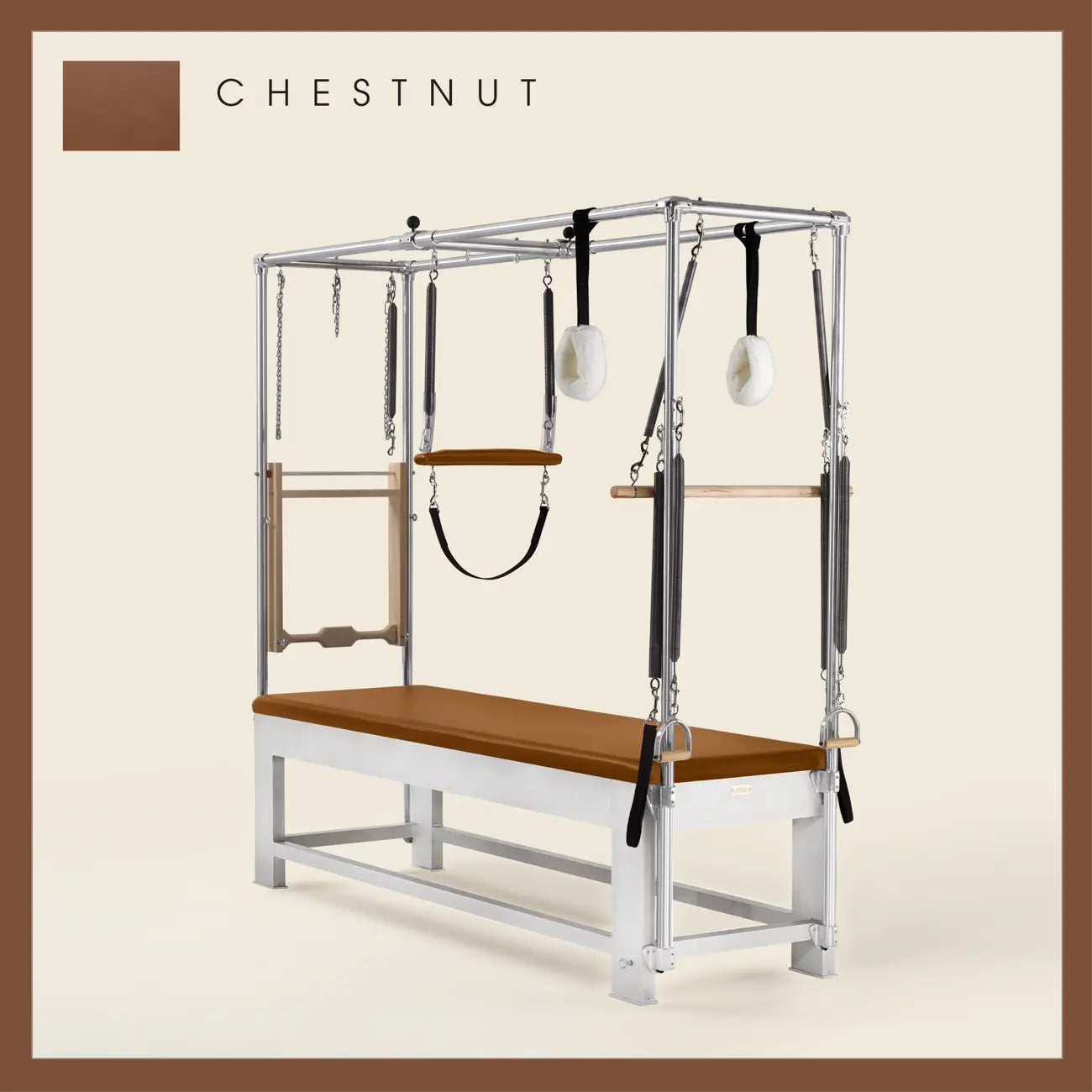 Chestnut color Trapeze Table with aluminum frame, adjustable bars, straps, and springs. Premium Pilates equipment against a beige background.
