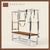 Chestnut color Trapeze Table with aluminum frame, adjustable bars, straps, and springs. Premium Pilates equipment against a beige background.