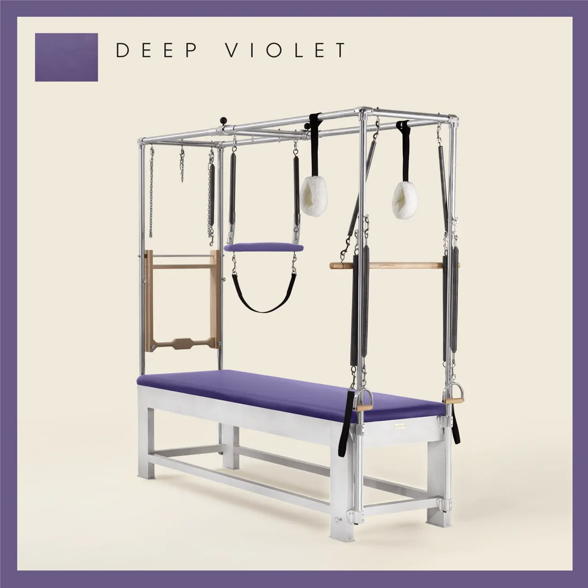 Deep Violet color Trapeze Table with aluminum frame, adjustable bars, straps, and springs. Premium Pilates equipment against a beige background.