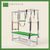 Emerald color Trapeze Table with aluminum frame, adjustable bars, straps, and springs. Premium Pilates equipment against a beige background.