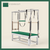 Forest color Trapeze Table with aluminum frame, adjustable bars, straps, and springs. Premium Pilates equipment against a beige background.