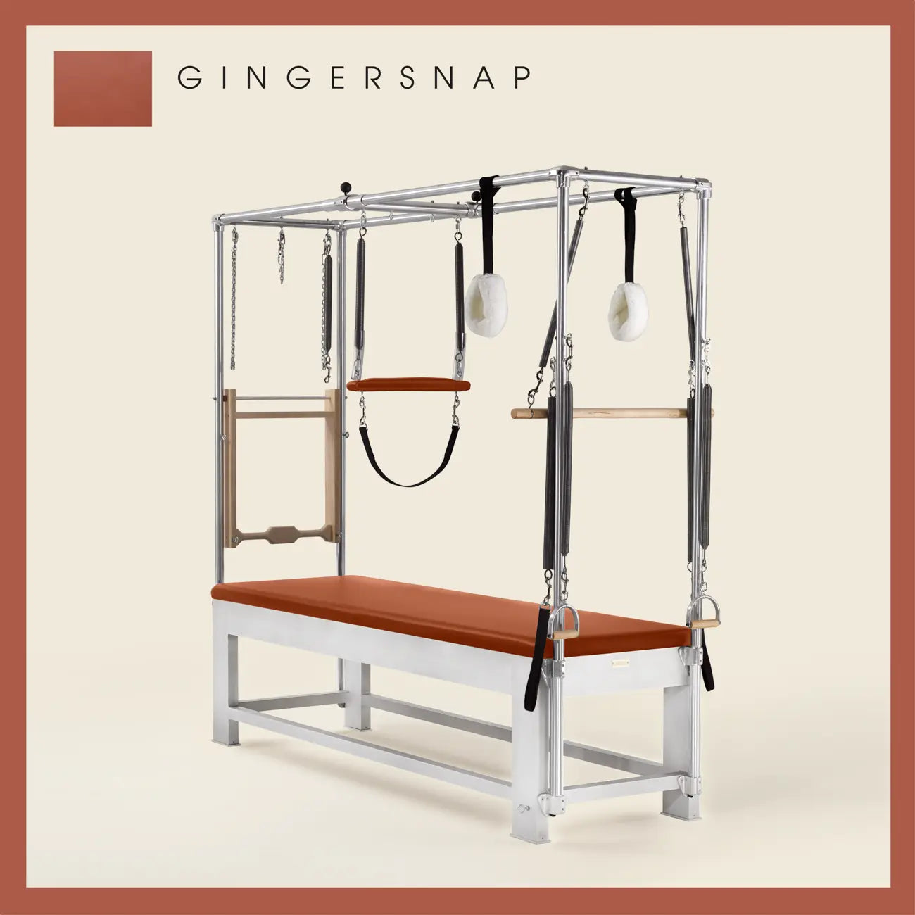 Gingersnap color Trapeze Table with aluminum frame, adjustable bars, straps, and springs. Premium Pilates equipment against a beige background.