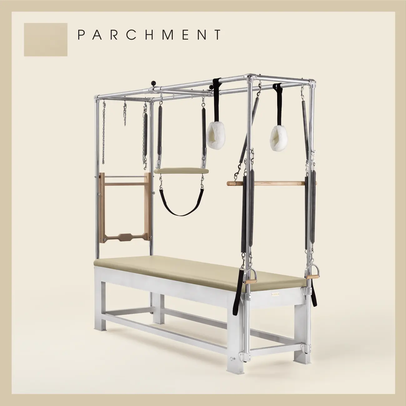 Parchment color Trapeze Table with aluminum frame, adjustable bars, straps, and springs. Premium Pilates equipment against a beige background.