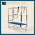 Regimental Blue color Trapeze Table with aluminum frame, adjustable bars, straps, and springs. Premium Pilates equipment against a beige background.