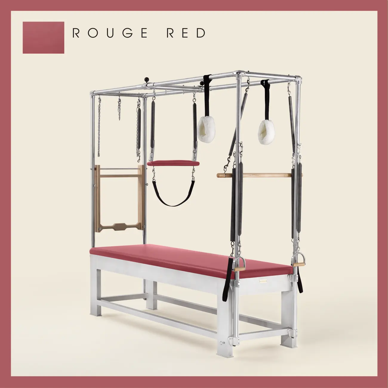 Rouge red color Trapeze Table with aluminum frame, adjustable bars, straps, and springs. Premium Pilates equipment against a beige background.