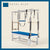 Royal blue color Trapeze Table with aluminum frame, adjustable bars, straps, and springs. Premium Pilates equipment against a beige background.