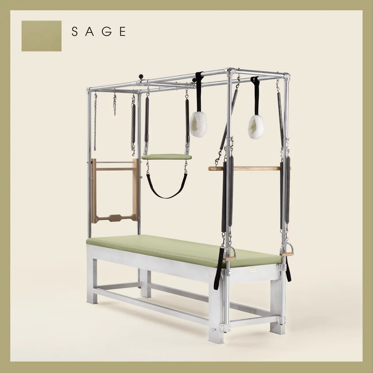 Sage color Trapeze Table with aluminum frame, adjustable bars, straps, and springs. Premium Pilates equipment against a beige background.