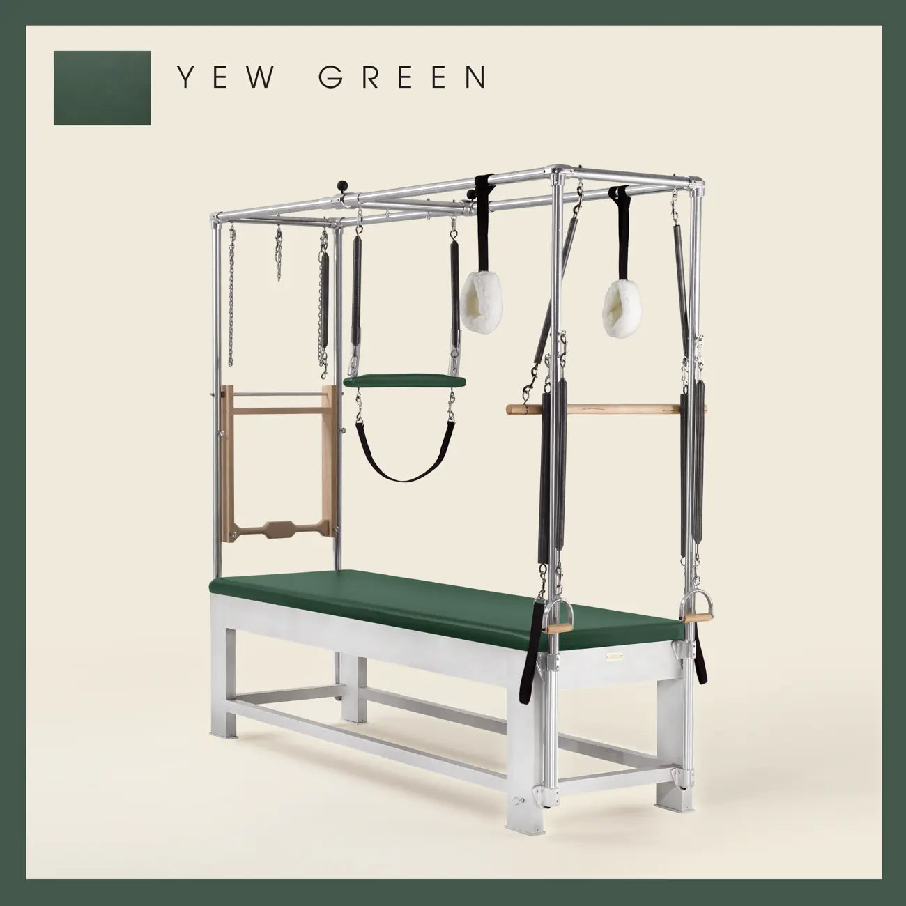 Yew green color Trapeze Table with aluminum frame, adjustable bars, straps, and springs. Premium Pilates equipment against a beige background.