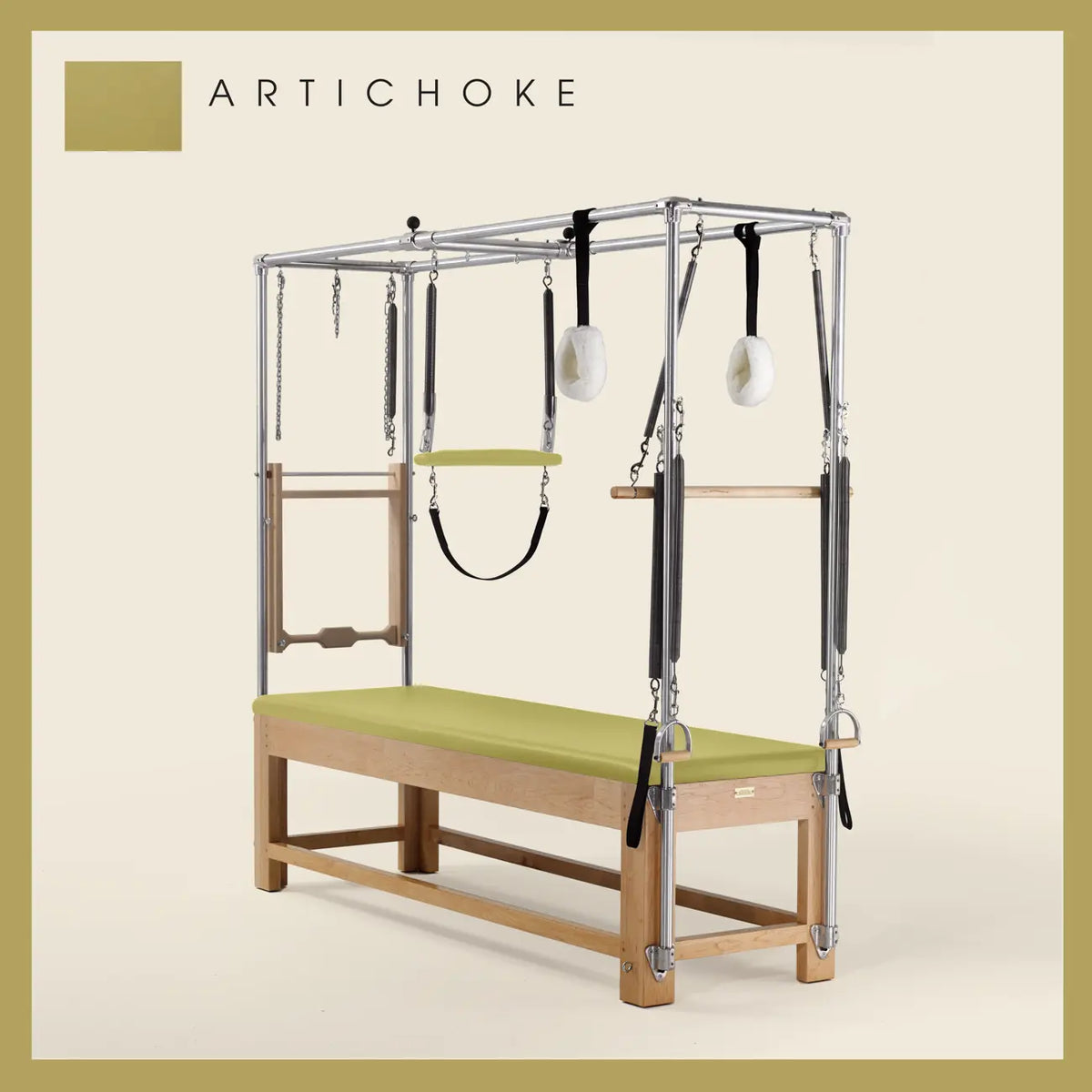 Artichoke color Pilates Cadillac with maple wood frame, adjustable bars, straps, and springs. Premium Pilates equipment against a beige background.