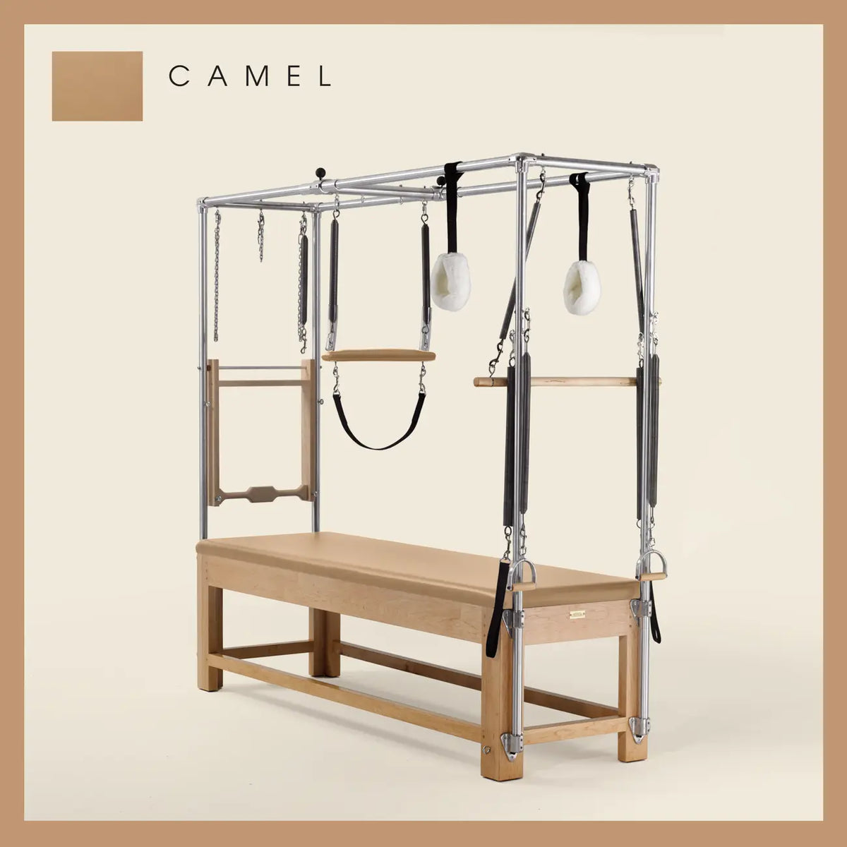 Camel color Pilates Cadillac with maple wood frame, adjustable bars, straps, and springs. Premium Pilates equipment against a beige background.