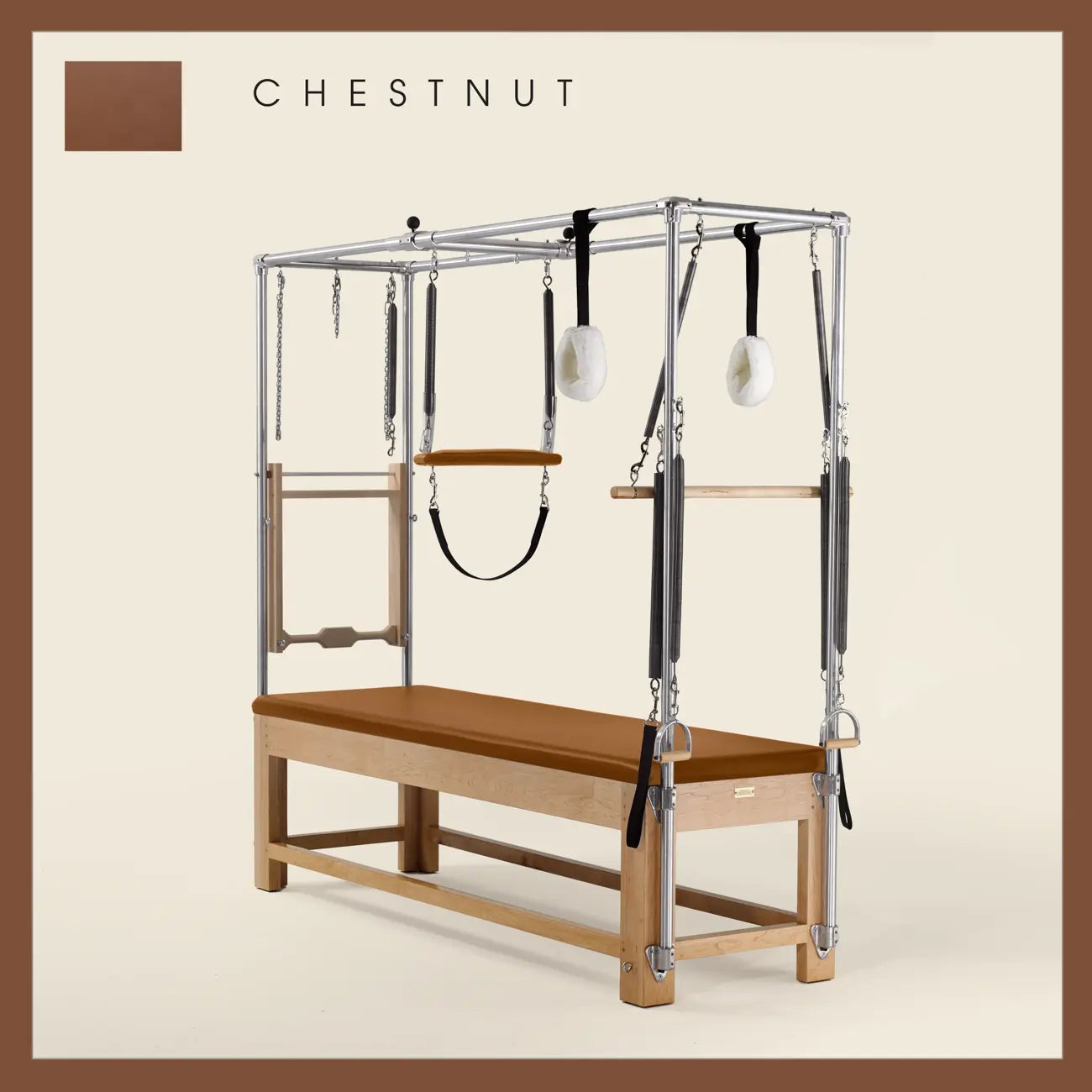 Chestnut color Pilates Cadillac with maple wood frame, adjustable bars, straps, and springs. Premium Pilates equipment against a beige background.
