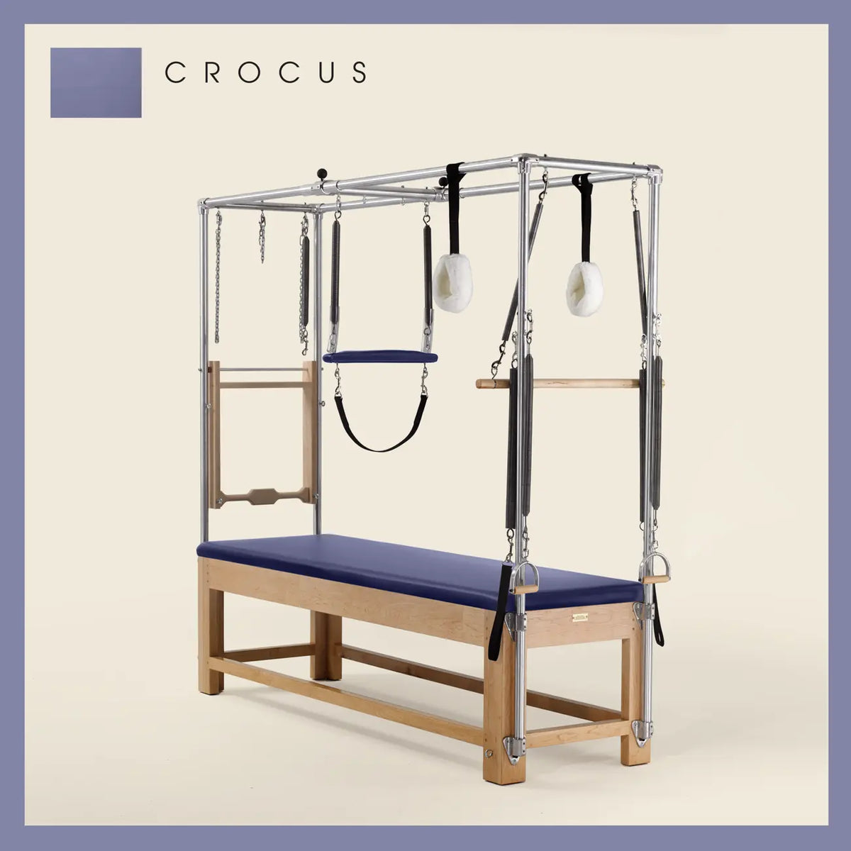 Crocus Pilates Cadillac with maple wood frame, adjustable bars, straps, and springs. Premium Pilates equipment against a beige background.