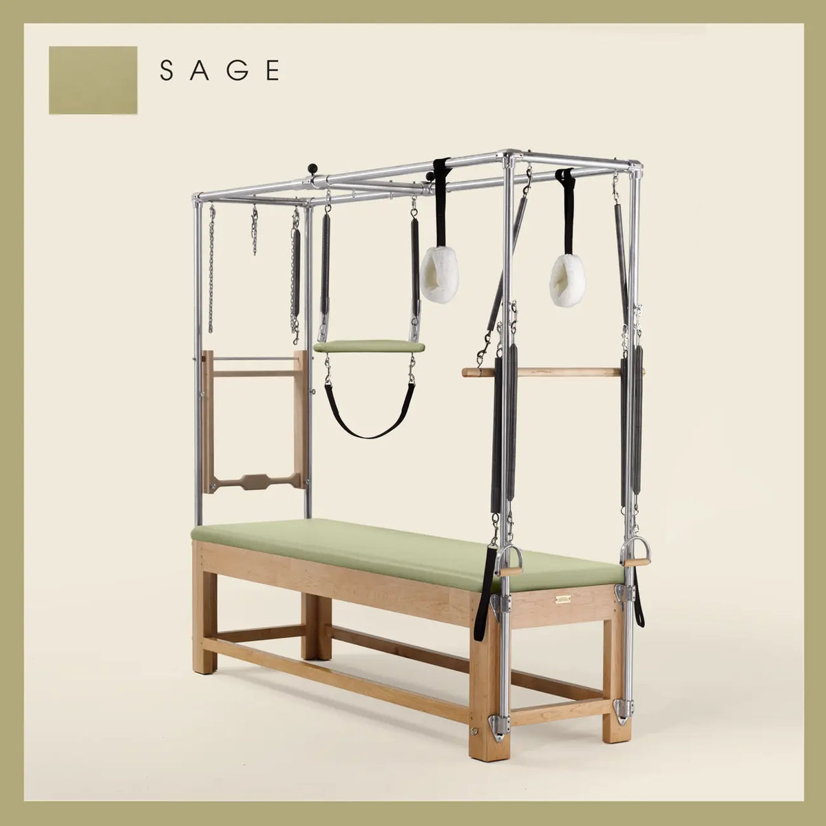 Sage Pilates Cadillac with maple wood frame, adjustable bars, straps, and springs. Premium Pilates equipment against a beige background.