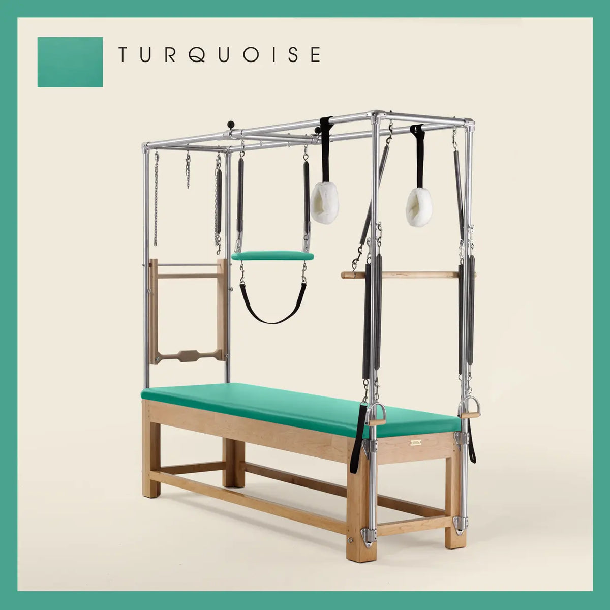 Turquoise Pilates Cadillac with maple wood frame, adjustable bars, straps, and springs. Premium Pilates equipment against a beige background.