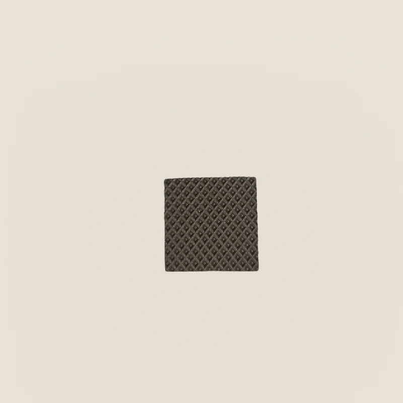 Single textured rubber grip pad for Gratz Pilates equipment feet.