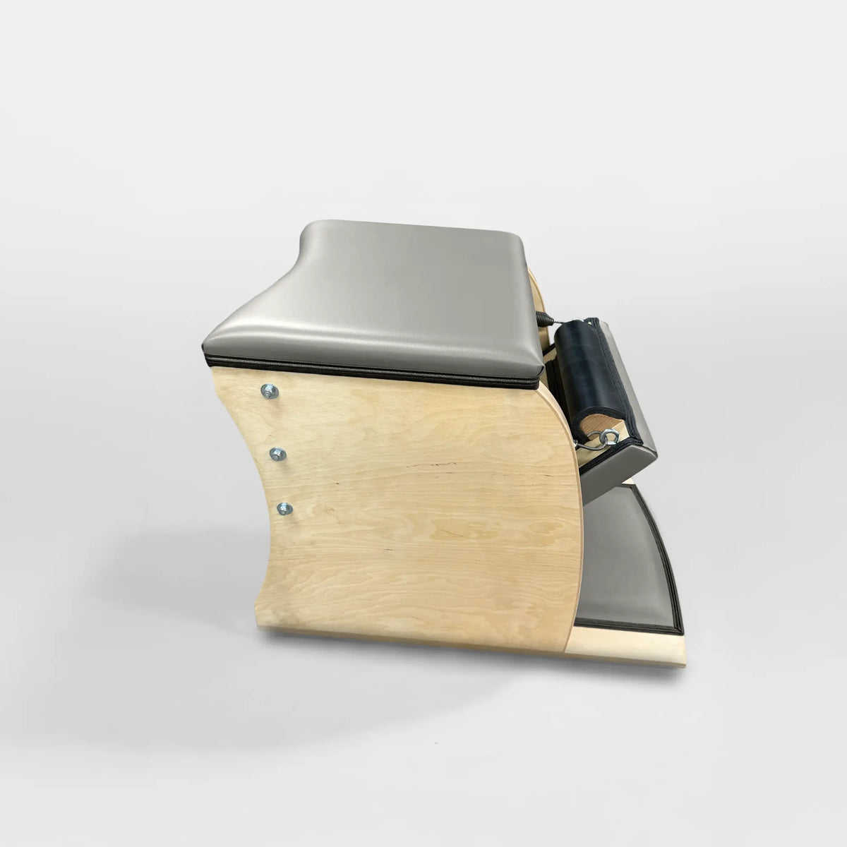 Gratz Pilates Wunda Chair in alabaster leather with maple wood base and spring pedal.