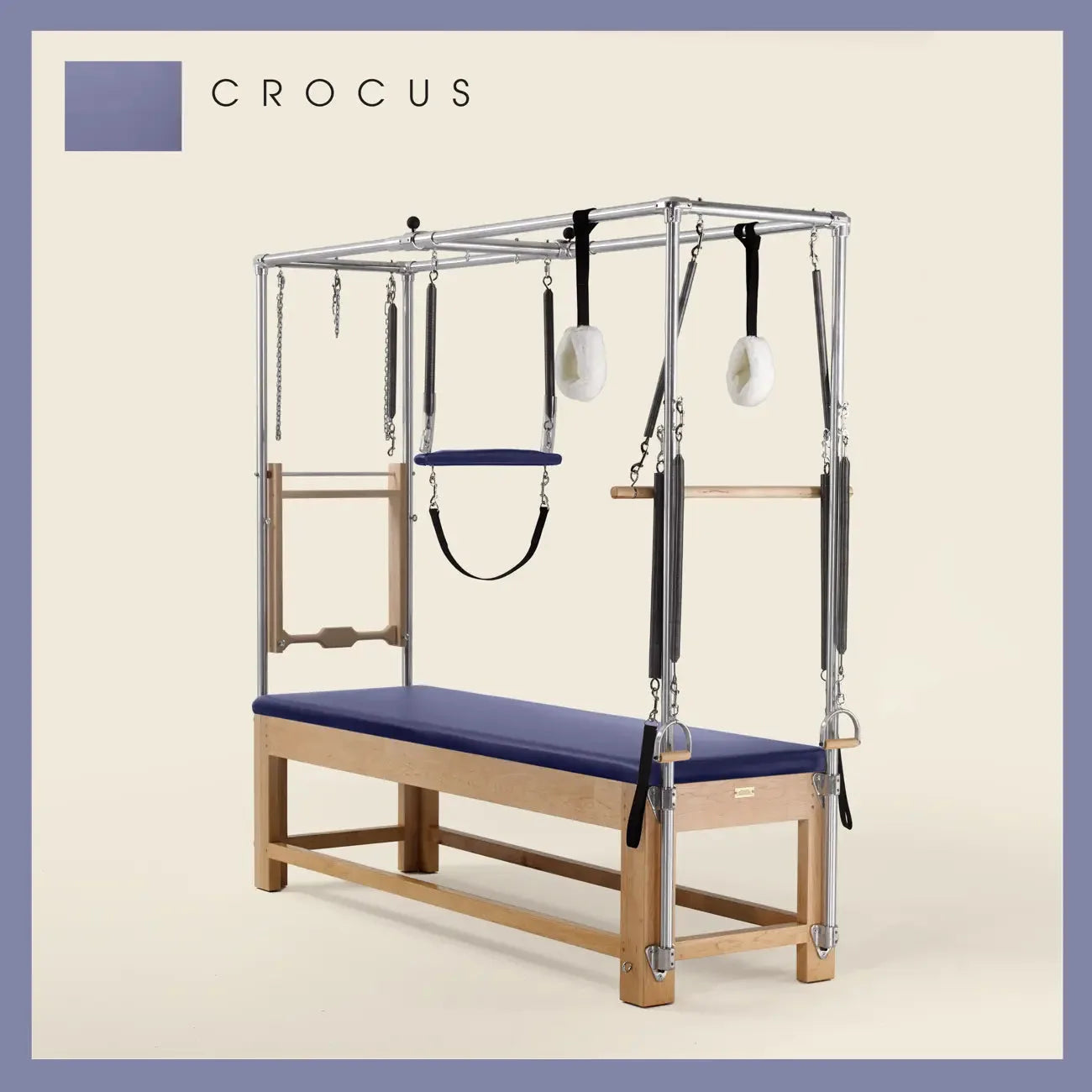 Crocus Pilates Cadillac with maple wood frame, adjustable bars, straps, and springs. Premium Pilates equipment against a beige background.