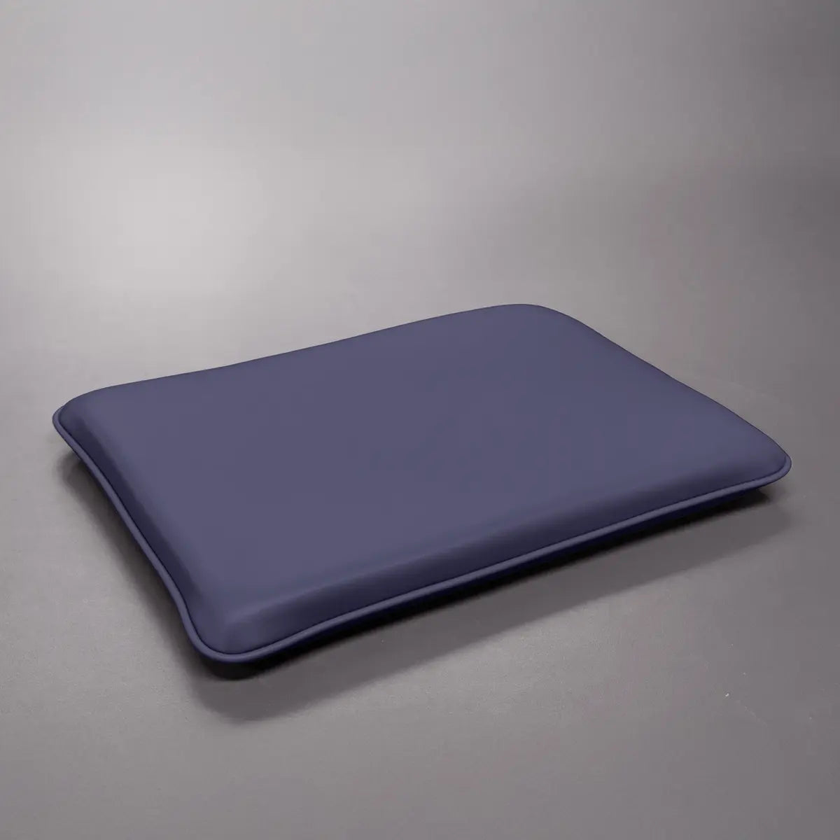 Dark Purple Naugahyde Pilates Electric Chair or Wunda Combo cushion on a gray background