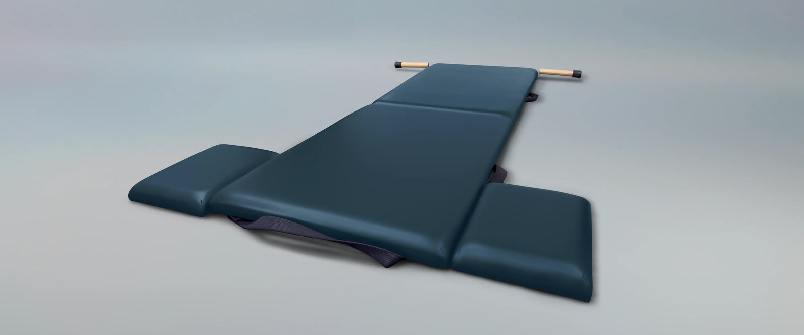 View of the Gratz Low Folding Mat in Imperial Blue on neutral blue/gray background