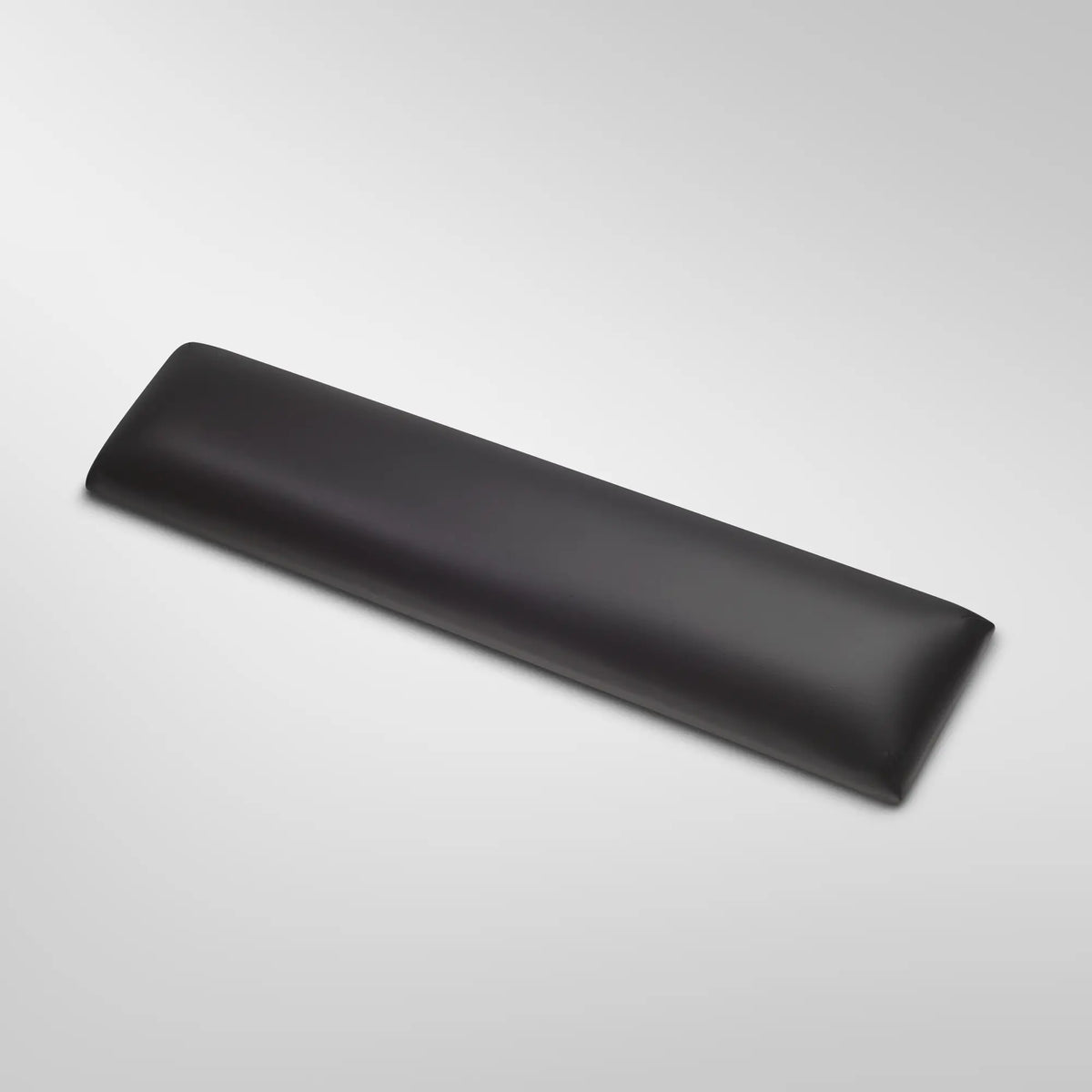 Gratz Pilates Kuna board with black padded leather cushion for reformer exercises.