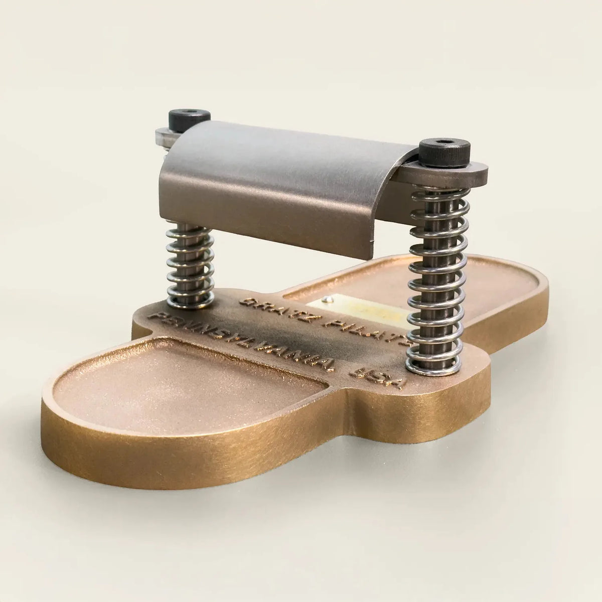 Wooden Pilates foot corrector apparatus with leather straps on neutral background